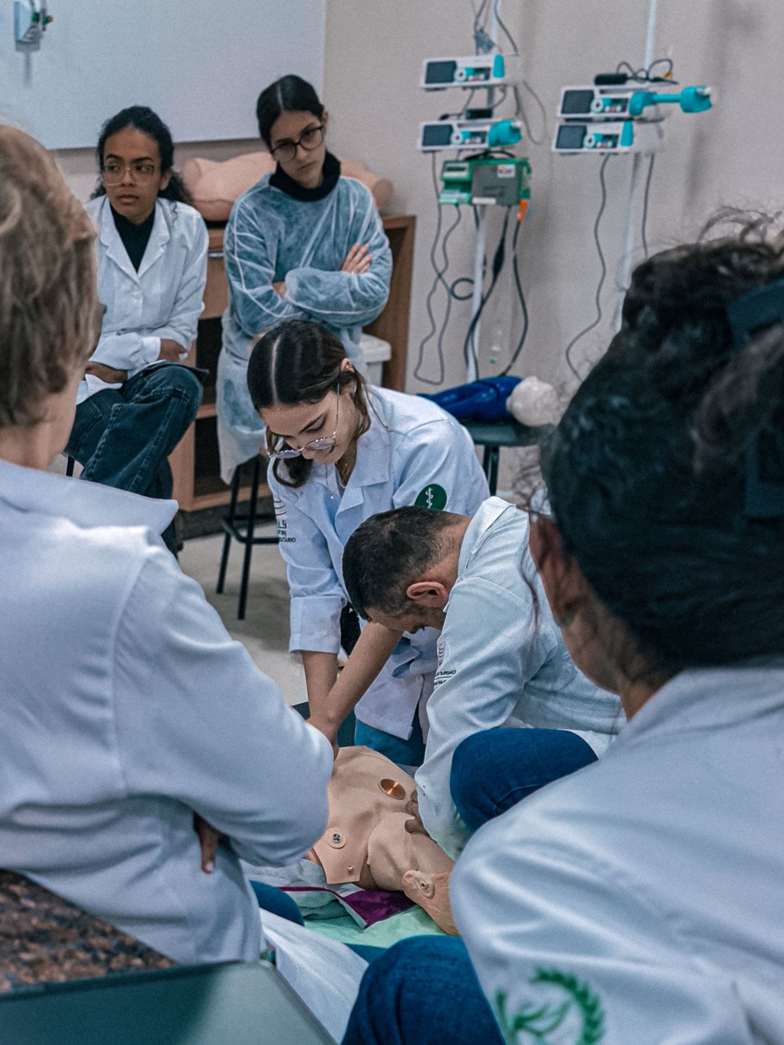 Clinical instructors teaching on a simulation mannequin