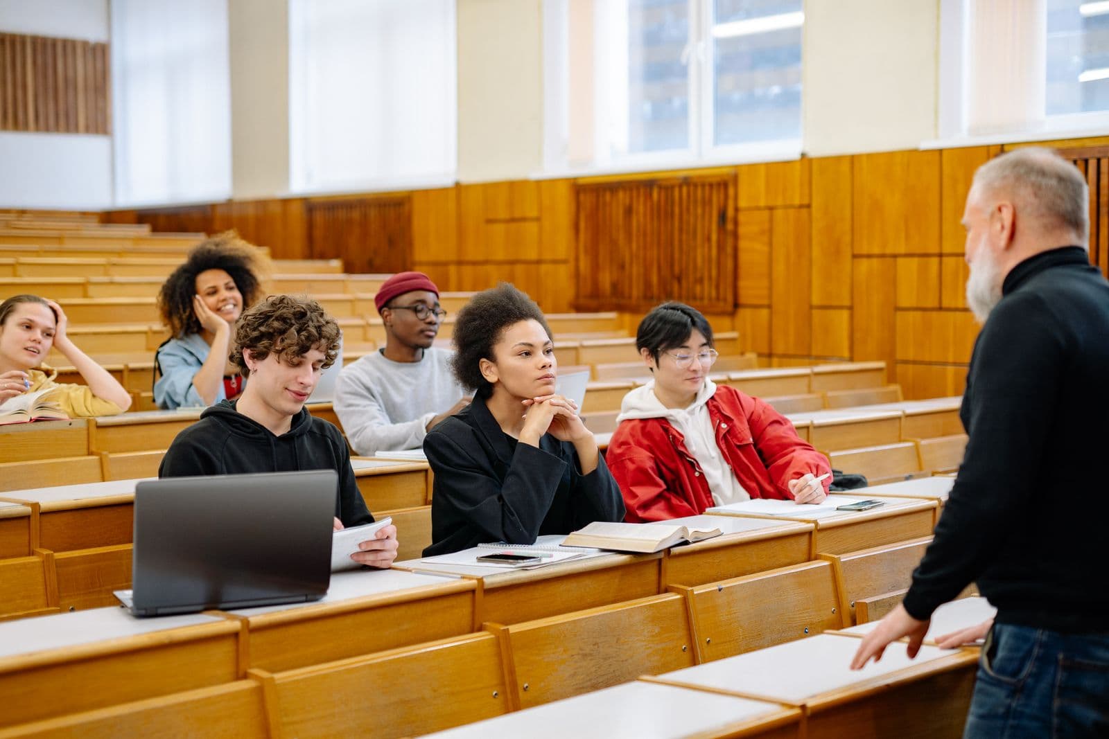 Students listening to a lecture in a university hall