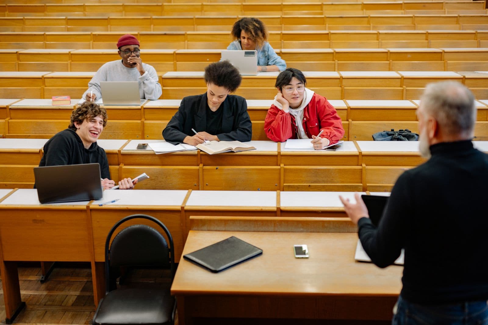 College students in a lecture hall with an instructor
